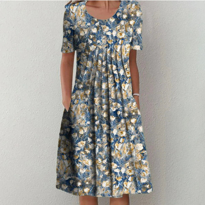 Ina - Pleated midi dress with floral print